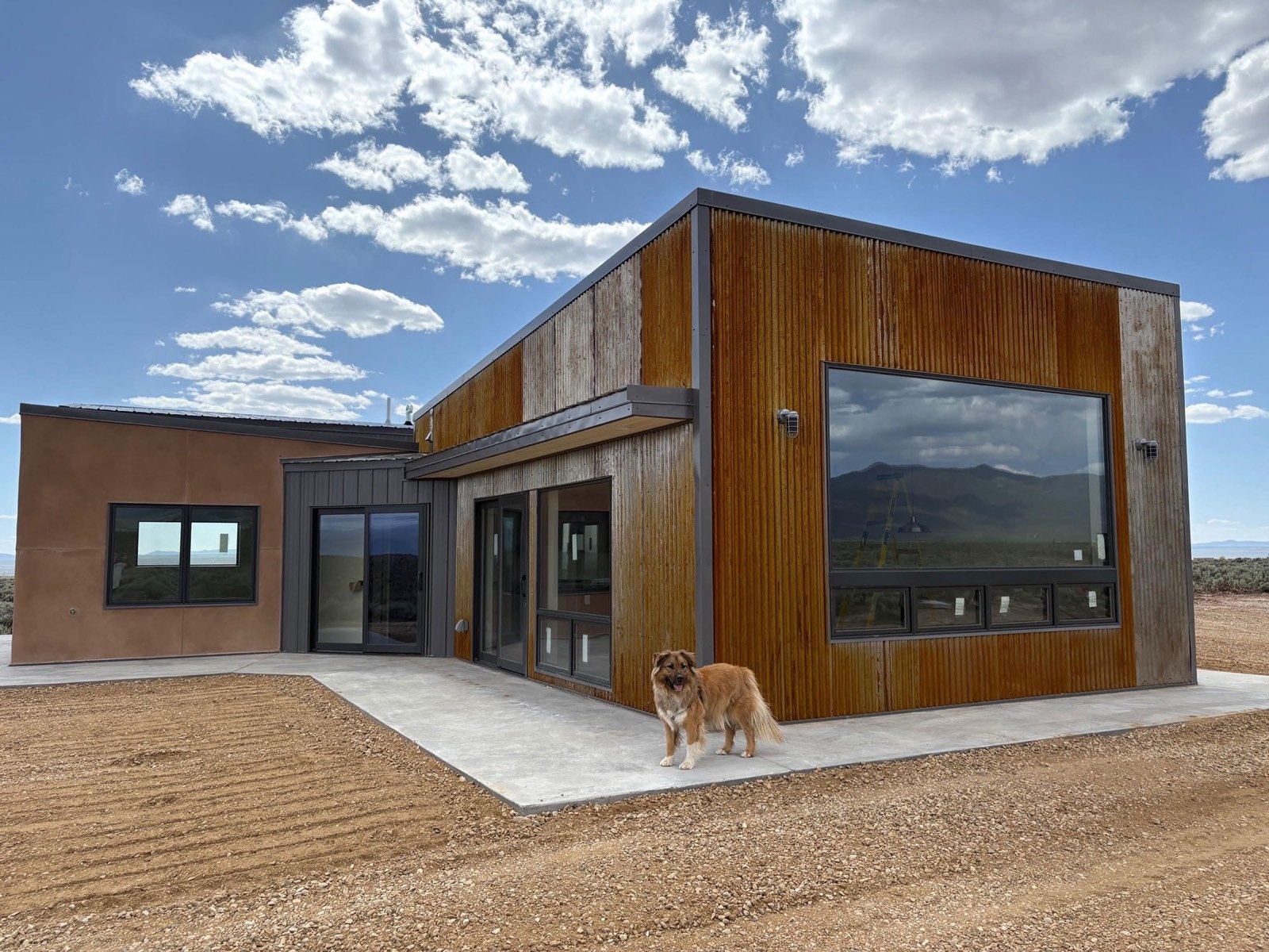 Corten steel and stucco desert modern home framing Sierra Nevada views, Lone Pine California