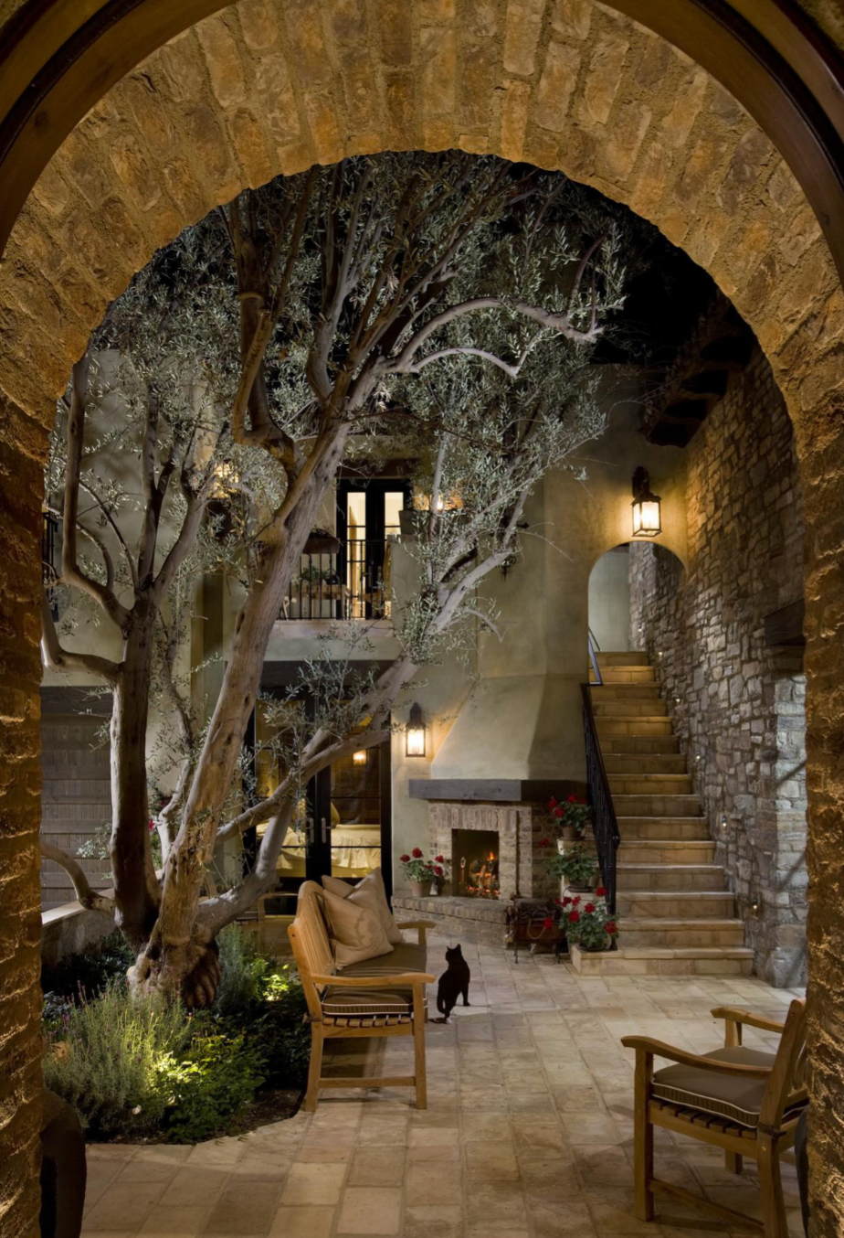 Tuscan stone estate with arched loggia, travertine courtyard and olive grove, San Diego California
