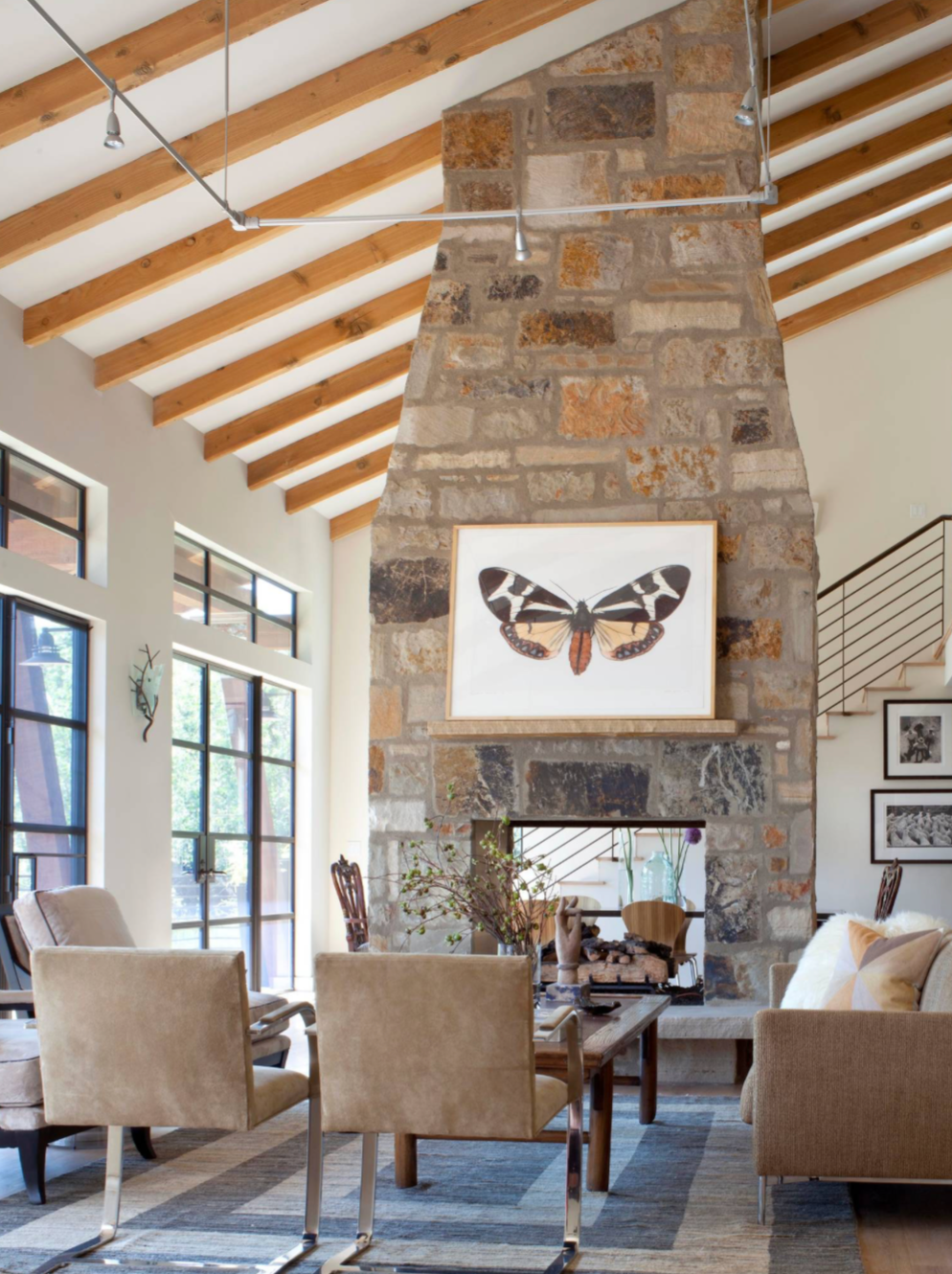 Tall stone fireplace in vaulted room